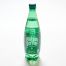 A green plastic bottle of Crystal Geyser Sparkling water with a green cap stands on a white surface.