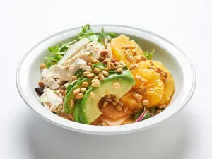 Enjoy Mary’s Farm chicken with mixed greens, avocado, citrus, melon, pinenuts & citrus dressing.