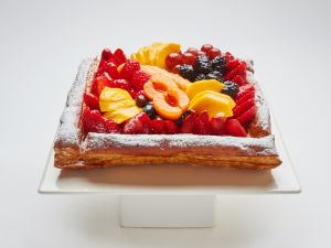 Bande cake topped with fruit in SF