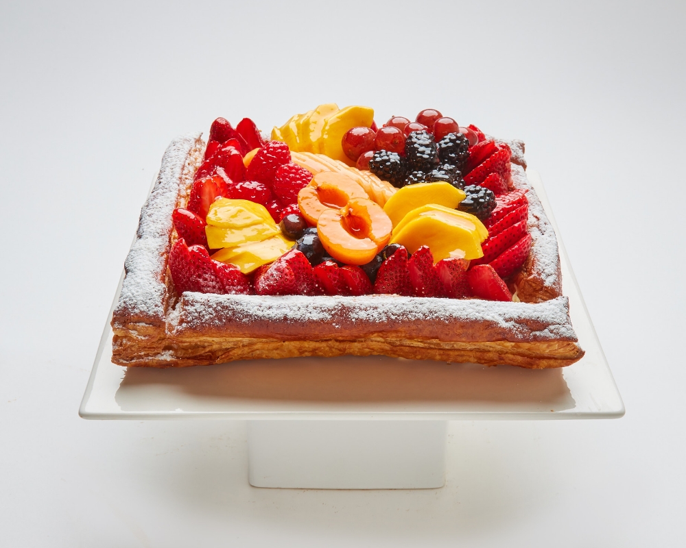 Bande cake topped with fruit in SF