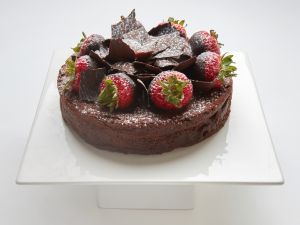Chocolate Flourless Torte cake in SF topped with chocolate and strawberries