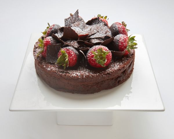 Chocolate Flourless Torte cake in SF topped with chocolate and strawberries