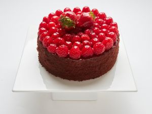 Chocolate Raspberry Truffle cake topped with strawberries in SF