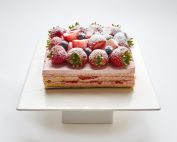 Strawberries and Cream layered cake topped with fresh strawberries in SF