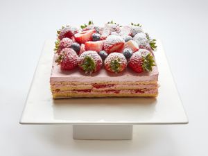 Strawberries and Cream layered cake topped with fresh strawberries in SF