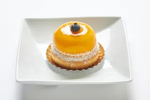 Sable dough tart with coconut custard and mango mousse.