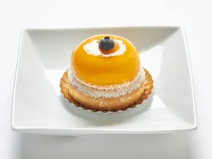 Sable dough tart with coconut custard and mango mousse.